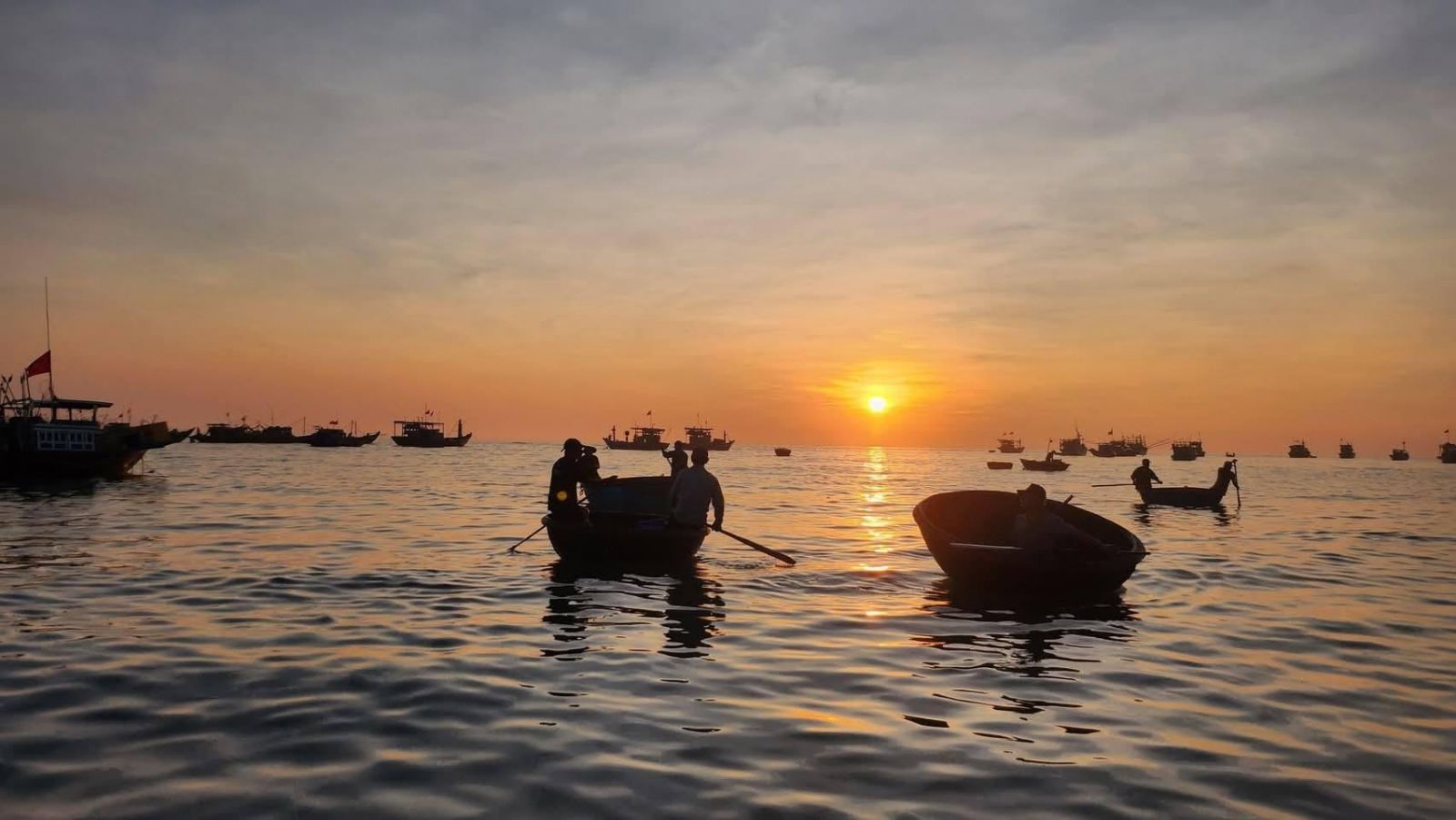 Peaceful fishing village welcoming the sunrise Da nang at Man Thai Beach.